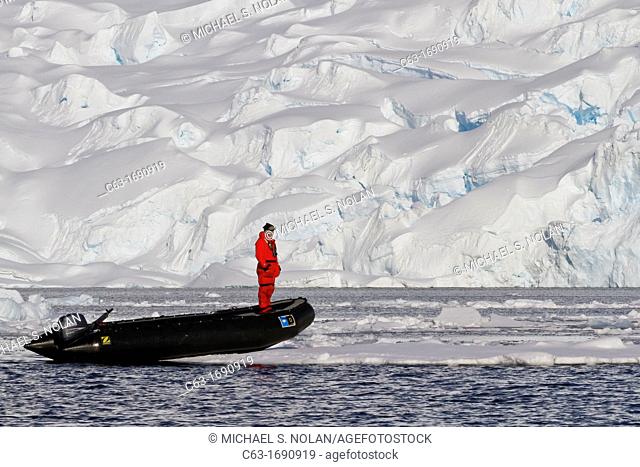 Staff from the Lindblad Expedition ship National Geographic Explorer shown here is Richard White working in Antarctica
