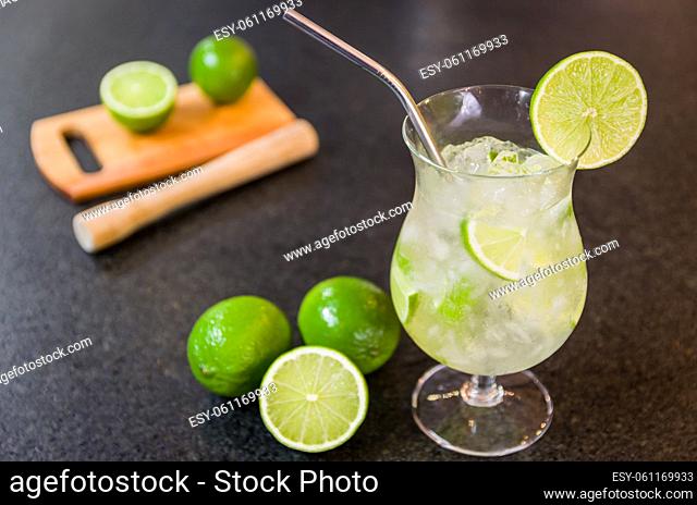 Caipirinha, traditional Brazilian alcoholic drink, typical drink made with sugar, lemon, distilled cane (cachaca) and ice with washable ecological straw