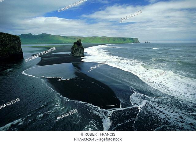 Black volcanic sand and sea stack at south coast bird sanctuary, Dyrholaey, Iceland, Polar Regions
