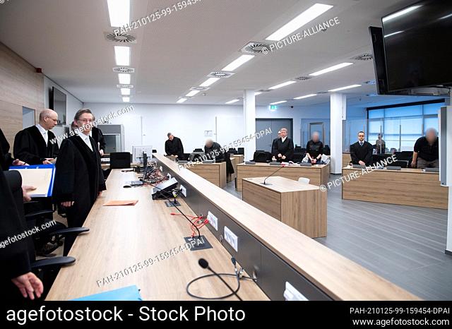 25 January 2021, Saxony, Dresden: Hans Schlüter-Staats (2nd from left), presiding judge at the Higher Regional Court, stands in front of the defendants in the...