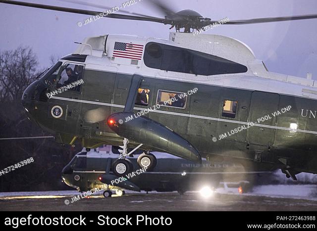US President Joe Biden (C) and First Lady Jill Biden (L) are seen on Marine One as they arrive at George Washington’s Mount Vernon home to attend the National...