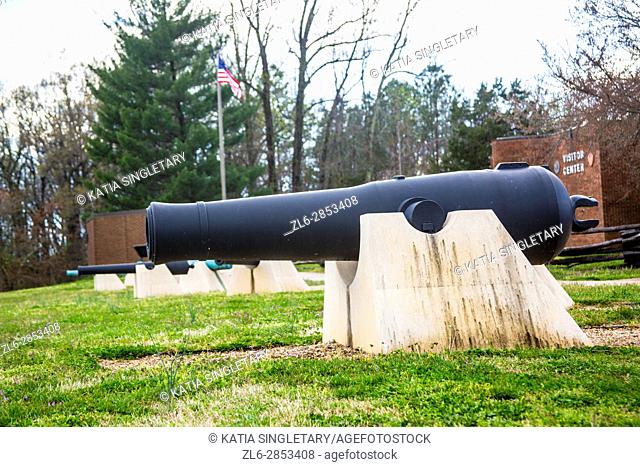 Old big fat iron canon set on the grass from the war