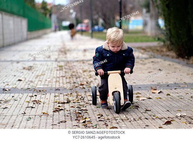 child on a tricycle