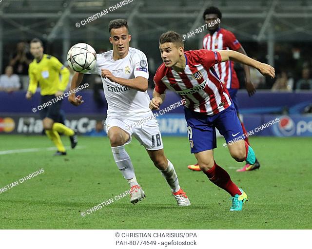 Atletico's Lucas Hernandez (L) vies for the ball with Real's Lucas Vazquez during the UEFA Champions League Final between Real Madrid and Atletico Madrid at the...