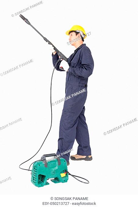 Young man in uniform stand and holding high pressure water gun portable with hose, Cut out isolated on white background