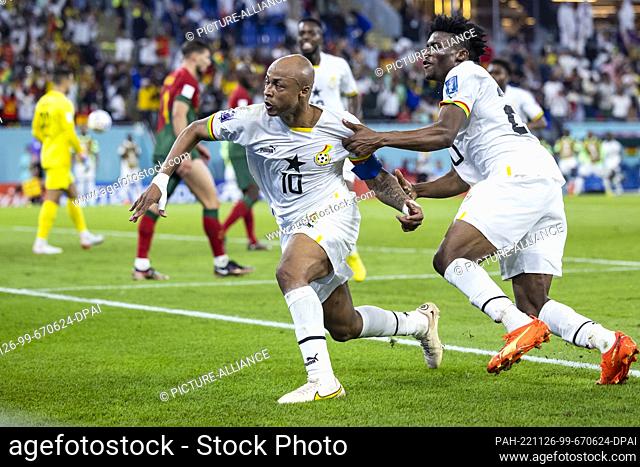 24 November 2022, Qatar, Doha: Soccer: World Cup, Portugal - Ghana, Preliminary Round, Group H, Matchday 1, Stadium 974, Ghana's André Ayew (l) celebrates with...