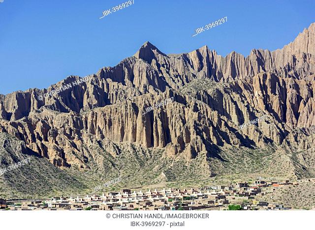 Rugged mountain and a planned settlement, social housing, Tilcara, Jujuy Province, Argentina