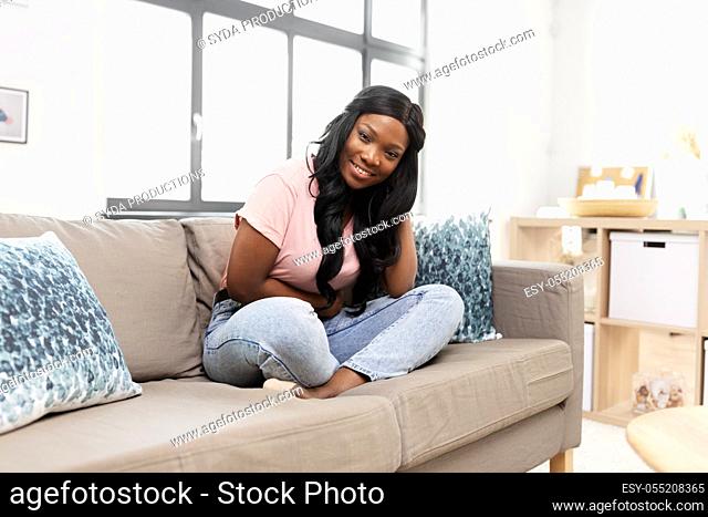 happy african american young woman at home