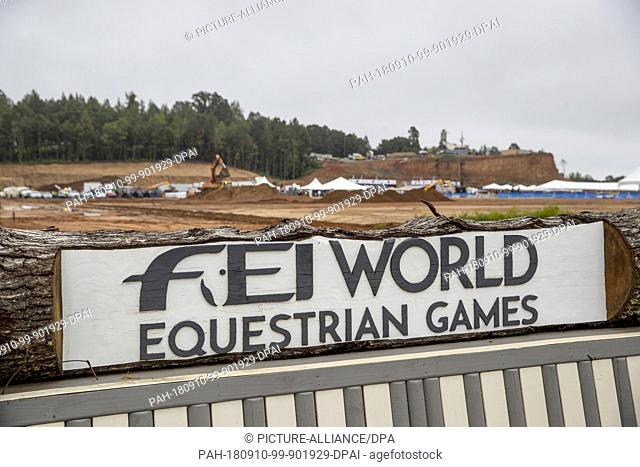 10 September 2018, North Carolina, Tryon: 10.09.2018, USA, North Carolina, Tyron: A sign with the words ""FEI World Equestrian Games"" overlooking the...