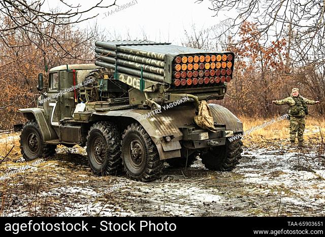 RUSSIA - DECEMBER 19, 2023: A serviceman is seen by a Grad multiple rocket launcher while performing a combat mission on the Donetsk direction of Russia's...