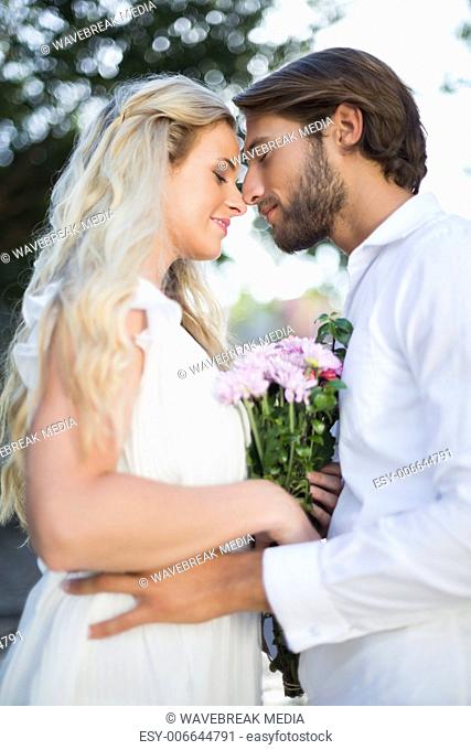 Attractive couple about to kiss each other