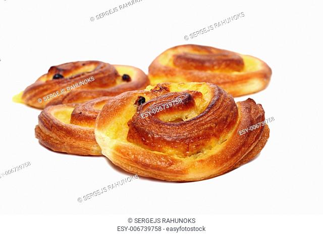 Fresh tasty buns with raisins isolated over white background
