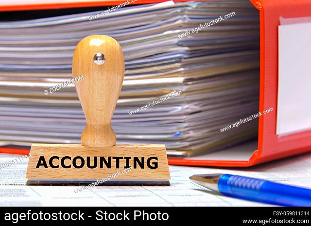 rubber stamp in office marked with accounting