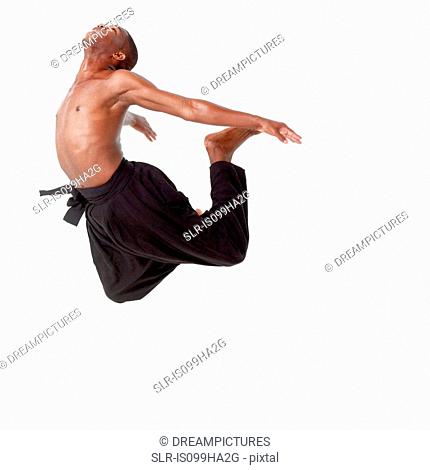 Young man in mid air
