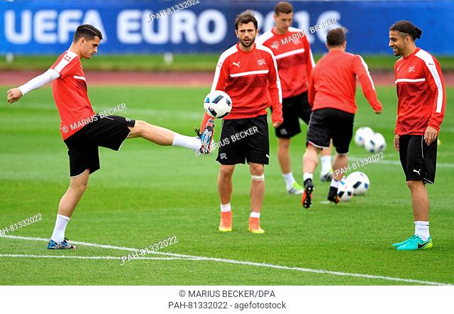 Granit Xhaka (L-R) , Admir Mehmedi and Ricardo Rodriguez of Switzerland in action during a training session of team Switzerland at the Stadium Nord Lille...
