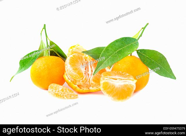 Orange mandarins with green leaves isolated on white background