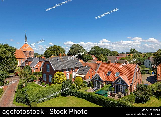 View from the Rysumer mill towards the church, Rundwarftendorf, Rysum, Krummhörn, East Frisia, Lower Saxony