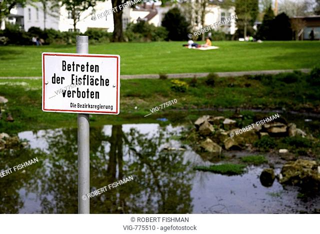Prohibition sign - Keep off the sheet of ice - in the garden of the academy of music in Detmold. - DETMOLD, NORTH RHINE-WESTPHALIA, GERMANY, 27/04/2008