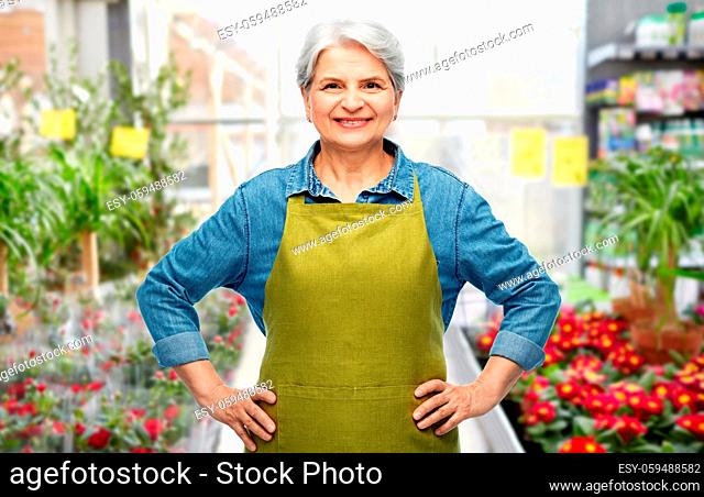 smiling senior woman in gardening center