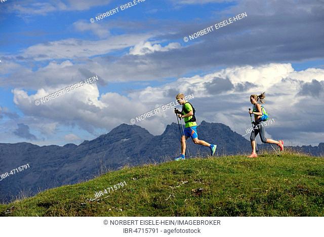 Hikers, Trail running on the Eggenalm, behind Loferer Steinberge, Reit im Winkl, Upper Bavaria, Bavaria, Germany