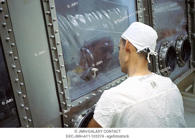 (august 1969) --- landrum young, brown and root - northrop technician, examines mice in the animal laboratory of the lunar receiving laboratory (lrl) which have...