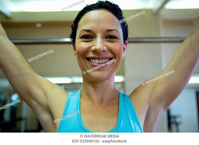 Portrait of happy woman exercising