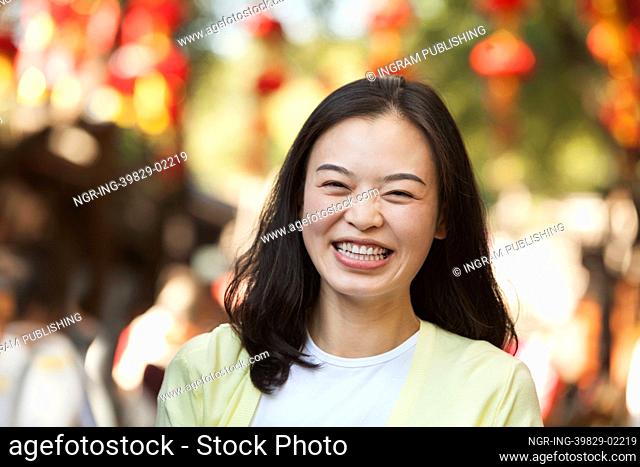 Laughing Mid Adult Woman In Nanluoguxiang, Beijing