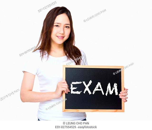 Young woman hold with blackboard showing a word exam