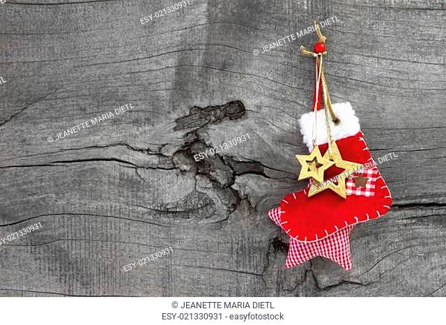 Red christmas or santa boot on a wooden old shabby country style background