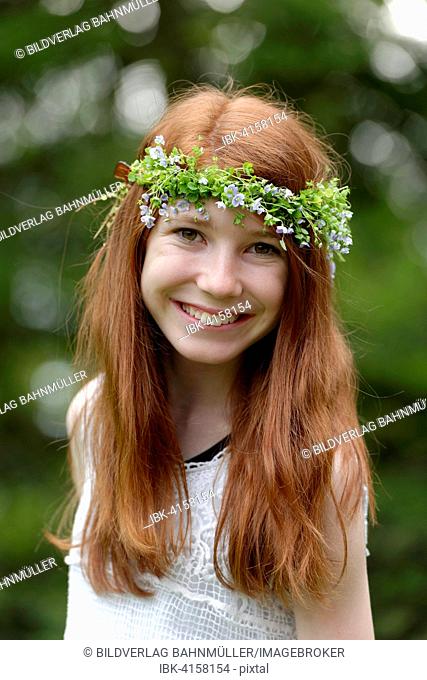 Flower child, girl with flower wreath in her hair