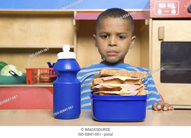 Boy looking at lunch box