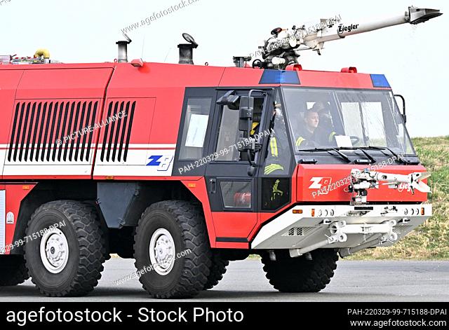 29 March 2022, Thuringia, Erfurt: Firefighters travel to a training session with the fire simulator at Erfurt-Weimar Airport