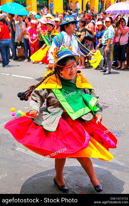 Local woman performing during Festival of the Virgin de la Candelaria in Lima, Peru. The core of the festival is dancing and music performed by different dance...