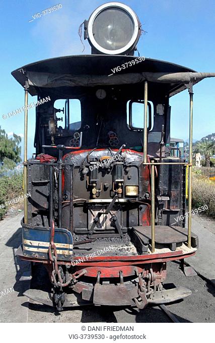Old coal-powered toy train steam engine of the Darjeeling Toy Train on the track around the Batasia Loop, a switchback created to lower the track gradient into...