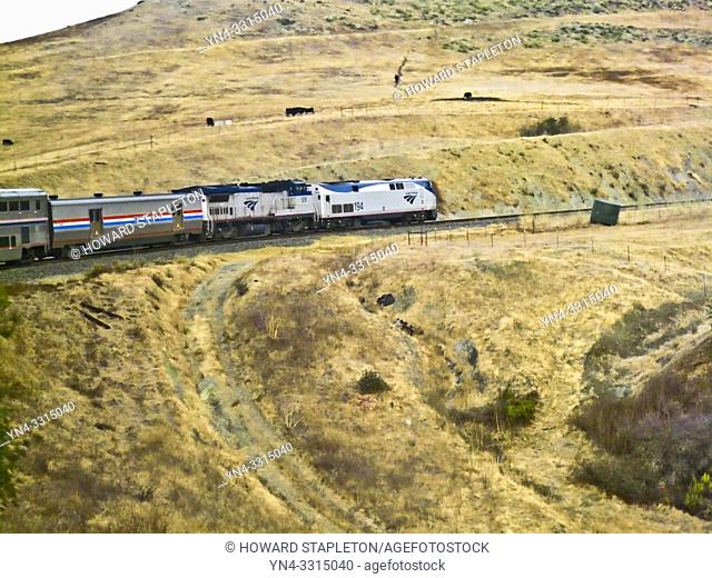 Northbound AMTRAK train on a horseshoe curve at the Cuesta Grade north of San Luis Obispo, California. Taken from a car near the center of the train