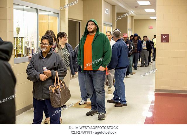 Detroit, Michigan - 8 November 2016 - Voters wait in line at Western High School for the 7:00am opening of the polls in the 2016 Presidential election