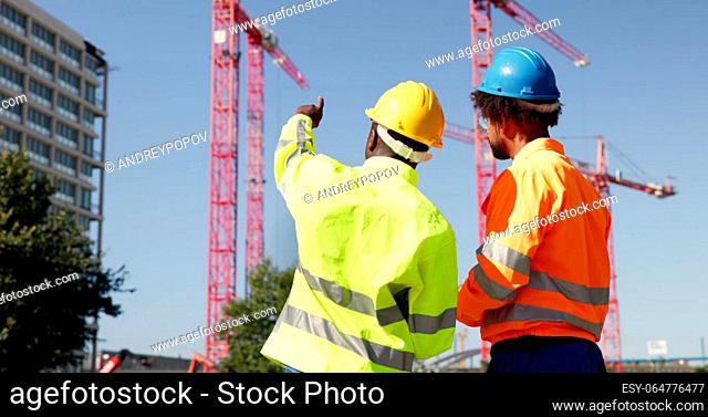Construct Site Engineer Pointing. Worker Inspector With Clipboard