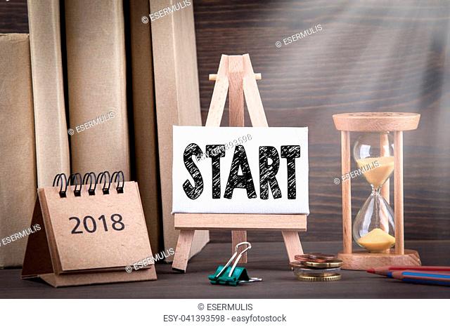 2018 start. Sandglass, hourglass or egg timer on wooden table showing the last second or last minute or time out