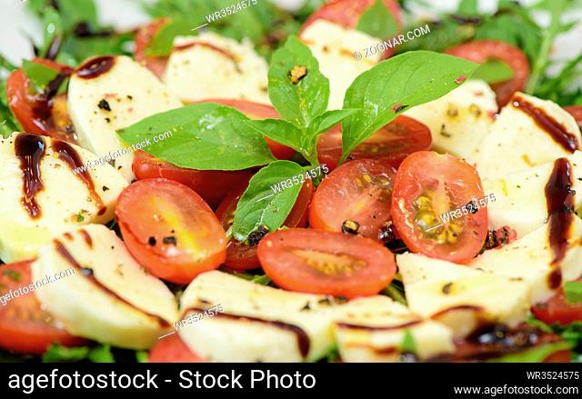 italian salad with rucola, mozzarella and tomatoes