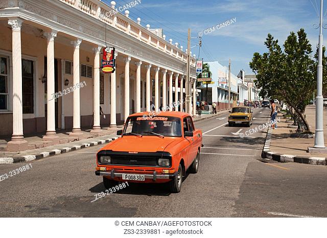 Old cars in the main avenue Prado at town center, Cienfuegos, Cienfuegos Province, Cuba, West Indies, Central America