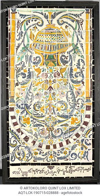 Tile panel of 98 tiles, multi-colored decorated with a vase of flowers and birds under an arch. Arabic text with 'Tunis and 1883', among others