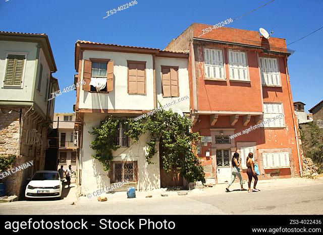 Women walking in front of the traditional Greek-Ottoman houses at the center of ancient Kydonies todays Ayvalik town, Balikesir, Aegean Region, Turkey, Europe