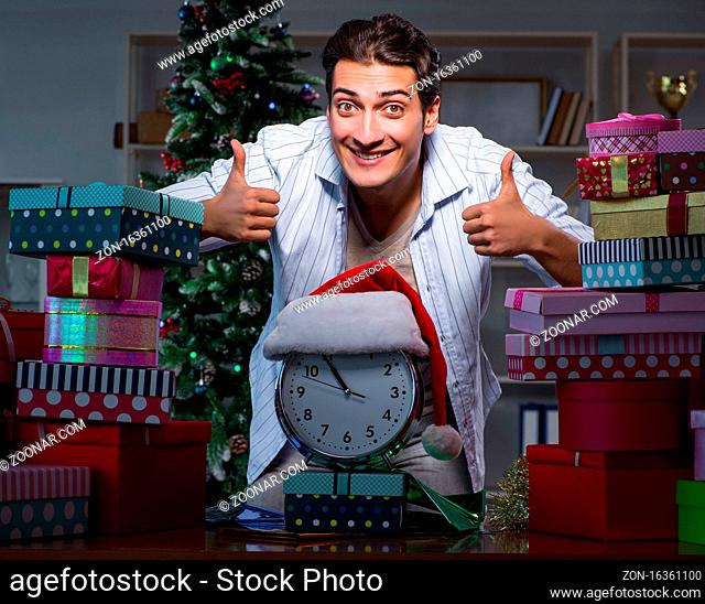 The man with many christmas gifts in boxes