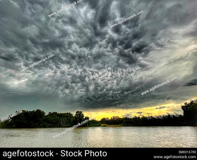Storm in the evening over the Daly River in the Northern Territory of Australia