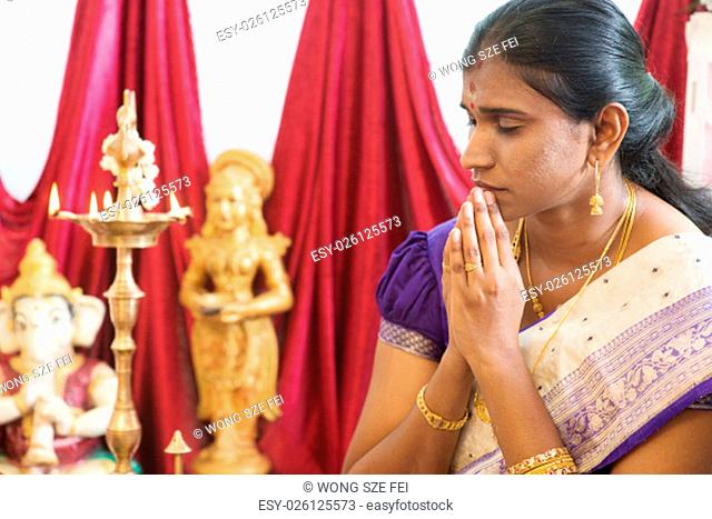 Woman hand folded during praying events. Traditional Indian Hindus ear piercing ceremony. India special rituals