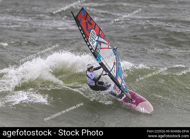 26 September 2022, Schleswig-Holstein, Westerland/Sylt: Maria Behrens from Lübeck surfs a wave in the Wave discipline at the Windsurf World Cup off Sylt