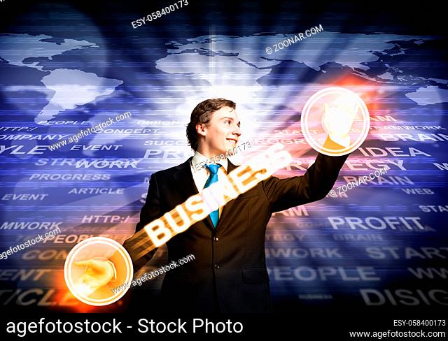 Handsome businessman in suit using virtual interface of computer application. Innovation technology in life and corporate business
