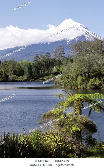 Mt. Egmont (Mt. Taranaki) NZ rises above Lake Mangamahoe near New Plymouth on No.Is