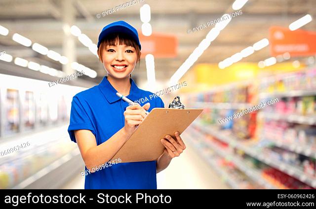 happy delivery woman with clipboard and pen