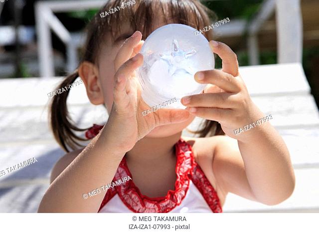 Close-up of a girl drinking water from a water bottle